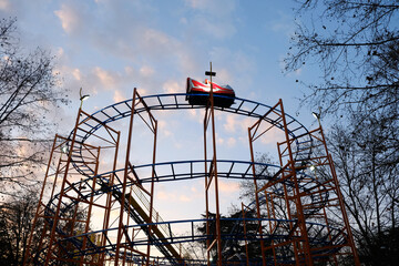 roller coaster Amusement Park Ride in the Luna Park during sunset.