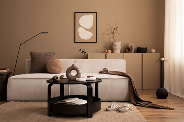 Interior design of cozy living room interior with mock up poster frame, modular sofa, round coffee table, vase with dried flowers, brown plaid, lamp and personal accessories. Home decor. Template.