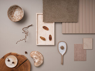 Fototapeta na wymiar Elegant flat lay composition with textile and paint samples, panels and cement tiles. Stylish interior designer moodboard. Light beige and gray color palette. Copy space. Template.