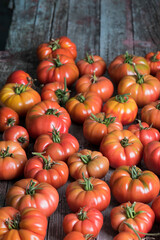 Vegetables, tomatoes on wooden desk