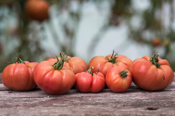 Vegetables, tomatoes on wooden desk