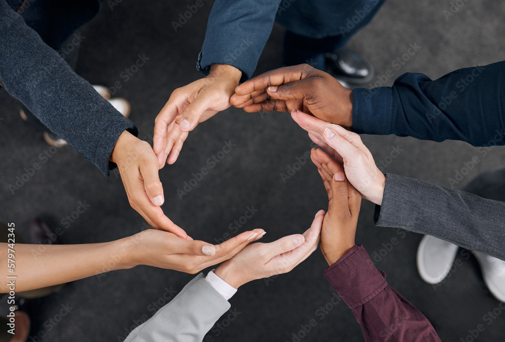 Poster A representation of unity. Shot of a group of businesspeople with their hands joined together to form a circle.