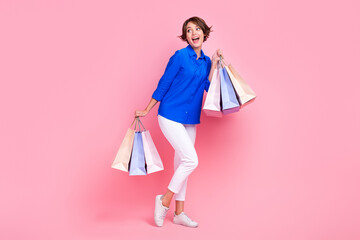 Full length photo of young excited business lady wear blue shirt white pants look interested mockup...
