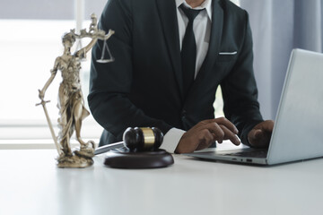 The concept of legal services of the Labor Law Consulting Office. lawyer working at desk Hammer and scales on lawyer table for justice