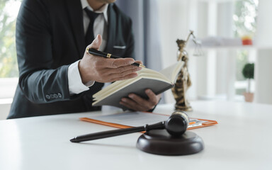 The concept of legal services of the Labor Law Consulting Office. lawyer working at desk Hammer and scales on lawyer table for justice