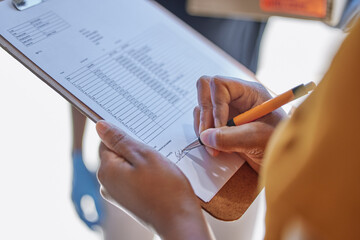 Closeup, clipboard and woman writing for delivery, ecommerce and logistics for sales service....