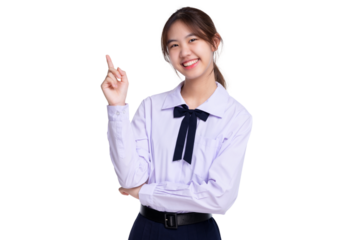 Happy pretty Asian student girl in school uniform pointing finger up isolated on transparent background, PNG file format.
