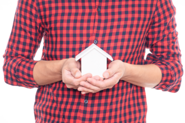 Man holding small house model.