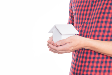 Man holding small house model.