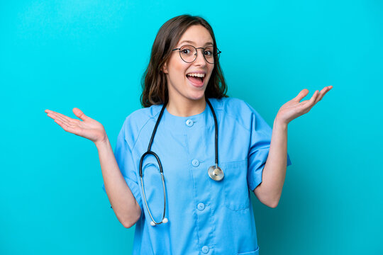 Young Surgeon Doctor Woman Isolated On Blue Background With Shocked Facial Expression