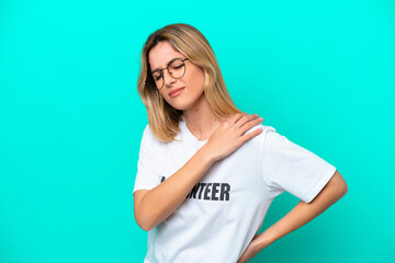 Young volunteer Uruguayan woman isolated on blue background suffering from pain in shoulder for having made an effort