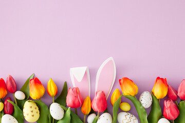 Easter concept. Top view photo of rabbit bunny ears colorful easter eggs and tulips flowers on isolated lilac background with empty space - obrazy, fototapety, plakaty