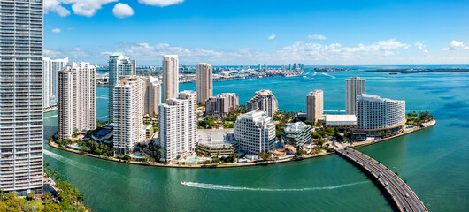 Aerial panorama of Brickell Key in Miami, Florida. Brickell Key (also called Claughton Island) is a man-made island off the mainland Brickell neighborhood of Miami, Florida. - 579754188