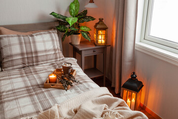 cozy scandinavian bedroom interior in natural tones, blanket candles houseplants - obrazy, fototapety, plakaty