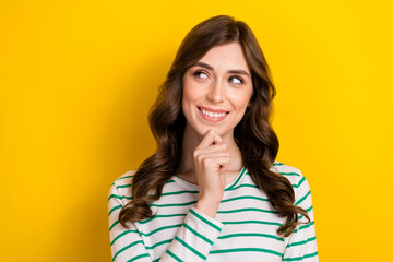 Fototapeta na wymiar Closeup portrait of charming pretty attractive good mood woman touch chin wear stylish shirt look empty space isolated on yellow color background