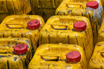 Stock of dirty plastic jerry cans