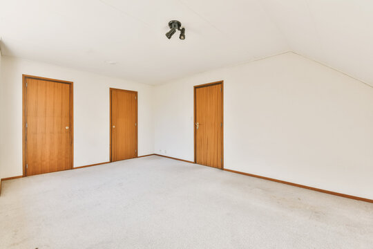 Empty light bedroom in attic