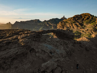Aerial View of Rocky Mountains with Roque Nublo and Archway, and Mount Teide in the Background in Gran Canaria, Spain