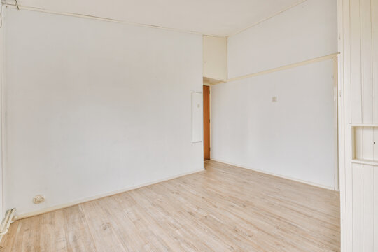 Interior of empty room with white walls
