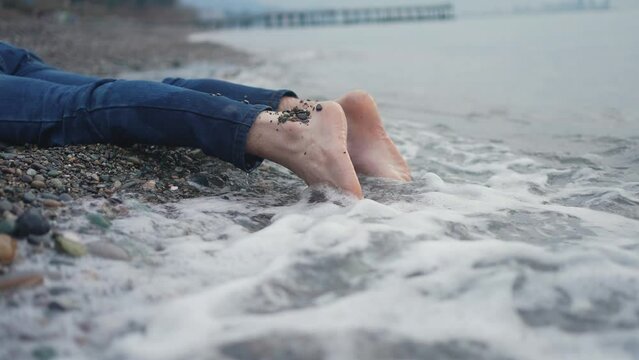 feet of a missing person drowned or shipwrecked on the beach slow mo