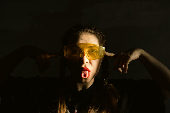 Girl in smart yellow glasses. Virtual reality glasses. Atmospheric fashion photos.
