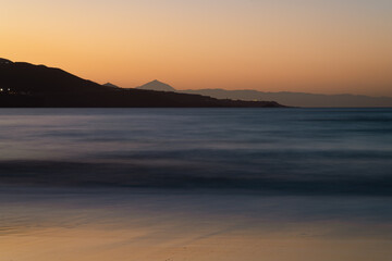 Beautiful View of Sunset from Las Canteras Beach, Gran Canaria, with Tenerife's Mount Teide in the Background