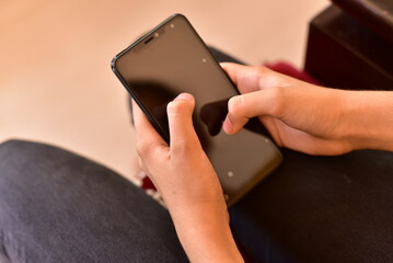 Person using internet on mobile for communication