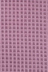 multicolored terry towels, rolled up and stacked on the table