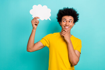 Photo of cheerful optimistic thoughtful guy dressed yellow t-shirt look at mind cloud hand on chin...