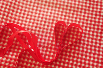 red ribbon fabric on a red background