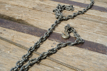 Fototapeta na wymiar metal chain on wooden truck bed