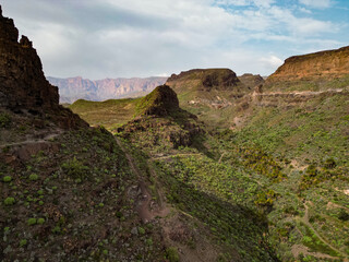 Horizontal aerial view of deep rocky ravine near the natural fortress site of Ansite in Gran Canaria, Spain