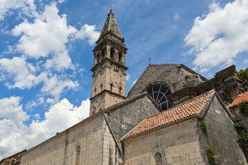 Fototapeta na wymiar The beautiful church of St. Nicholas with a tall belfry. Perast, Montenegro