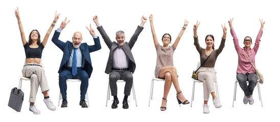 Happy successful people celebrating with raised arms