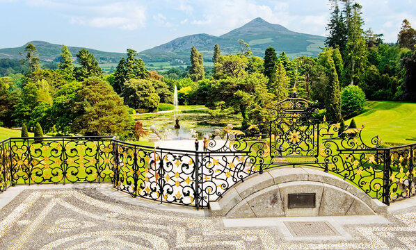 Powerscourt mansion, County Wicklow, Ireland. View over the Triton Lake to Great Sugar Loaf mountain from the Italianate terrace