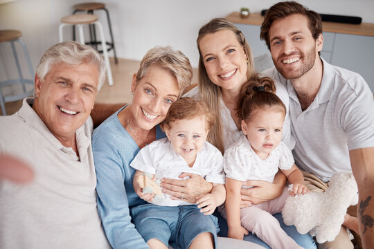 Selfie, family and children with grandparents, parents and girl siblings taking a photograph in a living room together. Kids, portrait and happy with a man, woman and daughter posing for a picture