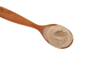 Psyllium flour in wooden spoon, close-up. Crushed Psyllium seeds and husk has been used as a...