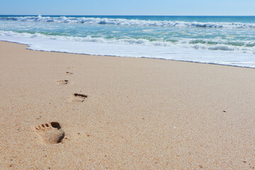 Print of foot steps on wet sand