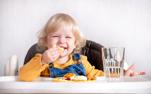 Cute child little girl eating healthy food in kindergarten