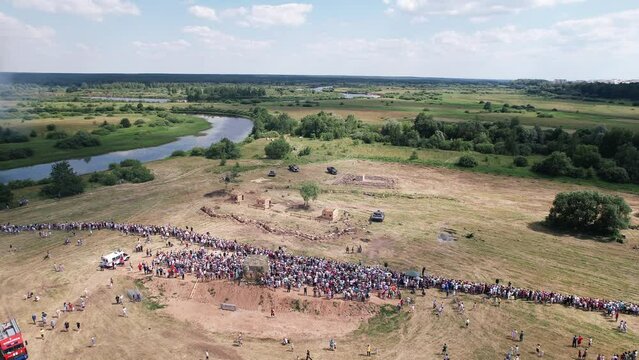 Aerial view of spectators on banks ofriver watching of battle of second world war