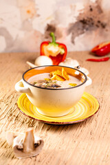 mushroom soup in a plate on the table in a restaurant