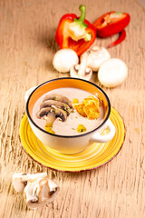 top view mushroom soup in a plate on the table in a cafe