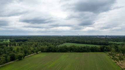 Land or landscape of green field in aerial view. Include agriculture farm, house building, village. That real estate or property. Plot of land for housing subdivision, development, sale or investment