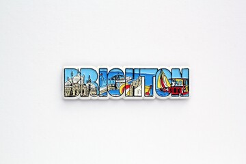 Colourful PVC souvenir fridge magnet of Brighton, England on white background. Travel memory...