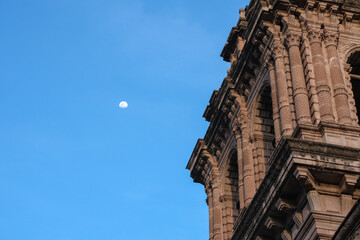 Close up cathedral details with moon at the sky. Selective focus. Open space area. 