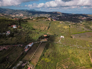 Naklejka premium Aerial view of countryside with fields and houses near crater in Gran Canaria, Spain