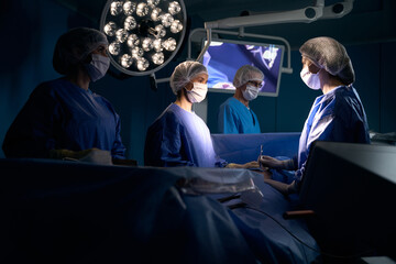 Man under anesthesia lies on the operating table