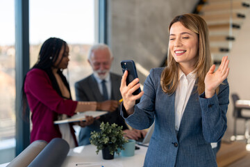 Happy young business woman employee HR manager having remote video call work hybrid meeting smiling...