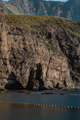 Obraz premium View of broken Dedo de Dios rock formation in Puerto de las Nieves, Agaete, in the northern coast of Gran Canaria, Spain