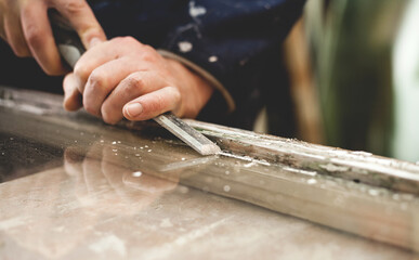 Restoration of old sash windows -  wooden frames are scraped from old patty and paint.